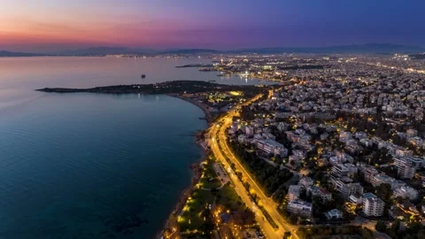 Aerial hyper lapse view of the illuminated Athens Riviera coast Video stock 320374137