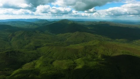 Aerial hyperlaps timelapse of misty clouds on tree covered mountains. Video stock 97530743