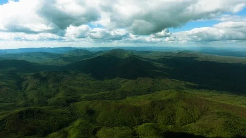 Aerial hyperlaps timelapse of misty clouds on tree covered mountains. Video stock 97530778