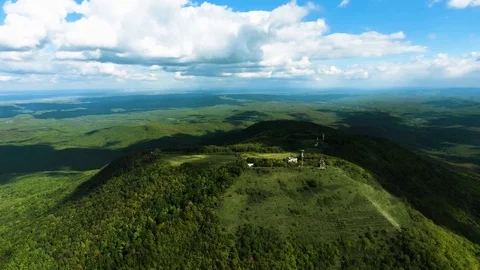 Aerial hyperlaps timelapse of misty clouds on tree covered mountains. Video stock 97530807