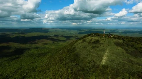 Aerial hyperlaps timelapse of misty clouds on tree covered mountains. Video stock 97530869