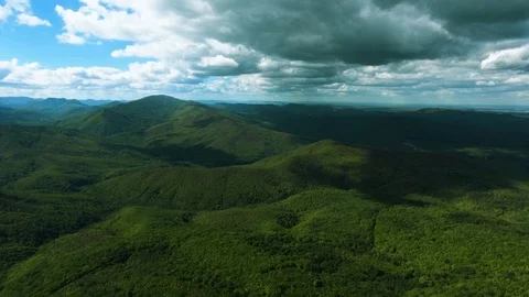 Aerial hyperlaps timelapse of misty clouds on tree covered mountains. Video stock 97530900