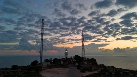 Aerial Hyperlapse 4K - Cap Sant Antoni Lighthouse Towers Dusk, Javea 動画素材 335550921