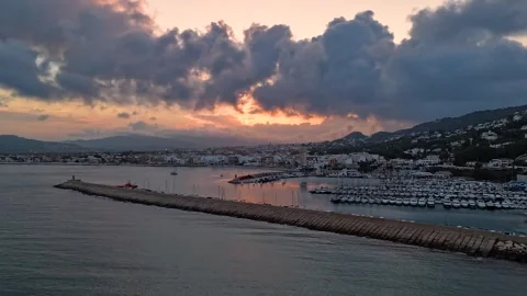 Aerial Hyperlapse 4K - Javea Marina Breakwater Stormy Sunset, Spain 動画素材 335549929