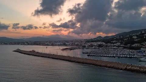 Aerial Hyperlapse 4K - Javea Marina Breakwater Stormy Sunset, Spain 動画素材 335549939