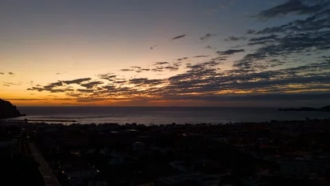 Aerial Hyperlapse 4K - Layered Clouds Blue Hour Over Javea Coast, Spain Видео 335549506