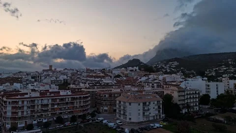 Aerial Hyperlapse 4K - Storm Advancing Over Javea Church Tower, Spain 動画素材 335549743