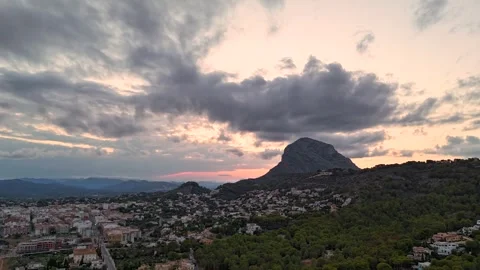 Aerial Hyperlapse 4K - Storm Clouds Over Montgó at Sunset, Javea Spain 動画素材 335501213