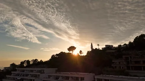 Aerial Hyperlapse 4K - Sunburst Pine Tree Hillside Villas, Altea Hills 動画素材 335551029