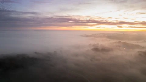 Aerial hyperlapse above the Mist during a splendid sunrise Stock Footage 244970989