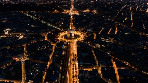 Aerial Hyperlapse of the Arc de Triomphe in Paris, France at night Stock Footage 123529921