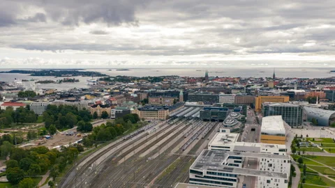 Aerial hyperlapse around the central railway station, cloudy fall day in Stock Footage 318786486