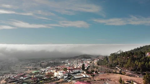 Aerial Hyperlapse A beautiful flight above the clouds over a small town with Video stock 104113178