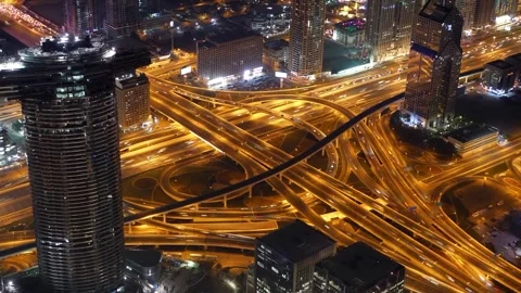Aerial hyperlapse busy highway interchange with fast moving traffic city night Stockbeeldmateriaal 342896998