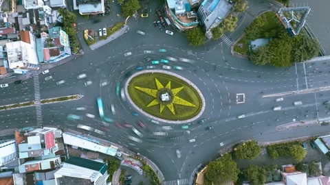 Aerial Hyperlapse Of Busy Traffic Roundabout in Ho Chi Minh City, Motorbike Flow Stock Footage 325181702