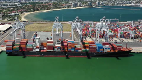 Aerial hyperlapse of cargo ship loading containers at the port Stock Footage 144715353