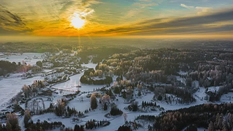 Aerial hyperlapse clouds moving over winter rural Latvia landscape snow covered Stock-Footage 331037532