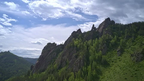 Aerial hyperlapse of clouds over the Takmak rock in the Russian Stolby Nature Stock Footage 169304809