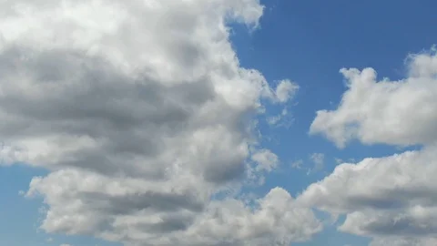 Aerial Hyperlapse of Clouds Rolling Towards on a Sunny Day Stock Footage 115596284