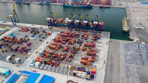 Aerial Hyperlapse Container ships in the harbor with bridges Crane  Video stock 116035666