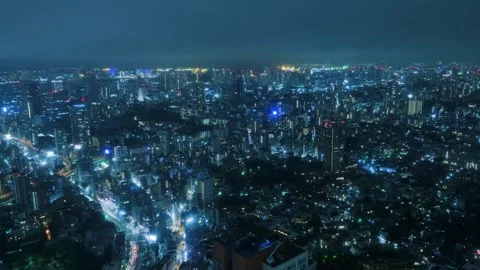Aerial hyperlapse drone video reveals illuminated Tokyo cityscape stretching Stock Footage 317545382