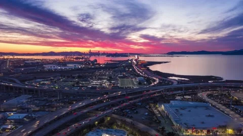 Aerial hyperlapse of fast moving freeway traffic at sunset showing cars and l Stock Footage 144149506