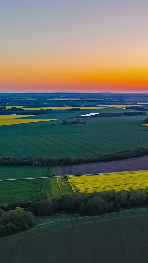 Aerial Hyperlapse Flyover Rapeseed Fields Sunset Orange Sky Farmland Vídeos de archivo 333857831