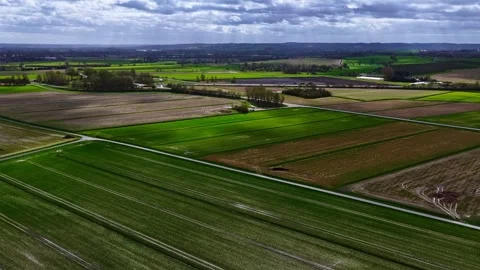 Aerial Hyperlapse Forward Flyover of Patchwork Agricultural Fields, Normandy Stock Footage 333312396