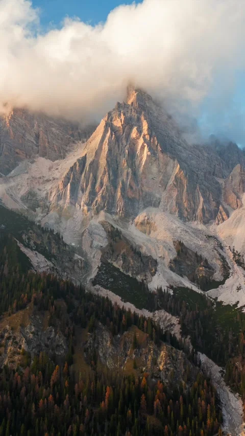Aerial hyperlapse of high mountain peak with clouds in Dolomites, Italy Stock Footage 295290588