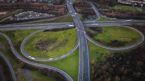 Aerial Hyperlapse of Highway Interchange at Sunset Stock Footage 299754138