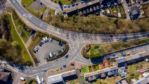 Aerial hyperlapse of Junction showing people traveling, virus lockdown uk Stock Footage 127199719