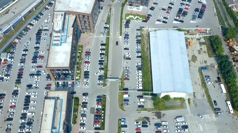 Aerial hyperlapse of large area of office buildings and Parking lots. Lots of Stock-Footage 113015127
