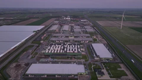 Aerial hyperlapse of a large scale data center at dusk in Middenmeer, The Stock Footage 275186913