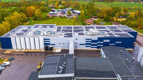 Aerial Hyperlapse Of Modern Dairy Processing Plant With Solar Panels On Rooftop Stock Footage 333314682