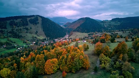 Aerial hyperlapse moving forward over colorful autumn valley and mountain Stock-Footage 319828265