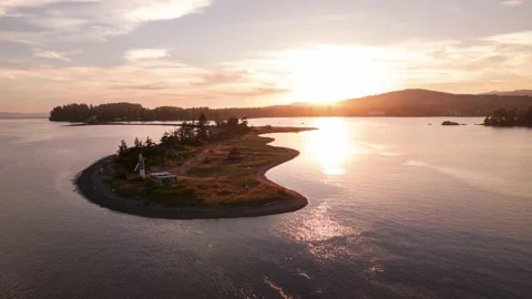 Aerial hyperlapse of ocean sunset, peninsula, boats in harbour, peaceful ocean Video stock 204103366