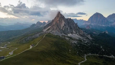 Aerial hyperlapse orbiting a peak at sunset, Passo Giau Video stock 346288905