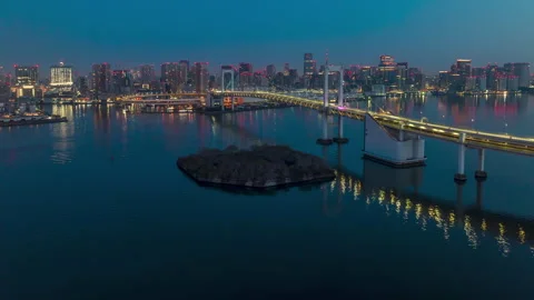 Aerial Hyperlapse over Tokyo an Rainbow Bridge at sunrise Stock Footage 311590298