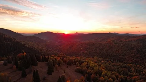 Aerial hyperlapse showing forward motion over colorful autumn mountain valley at Stock Footage 319828781