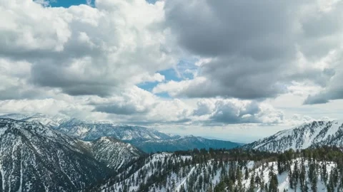 Aerial Hyperlapse of snow covered mountains near Los Angeles Video stock 251059098