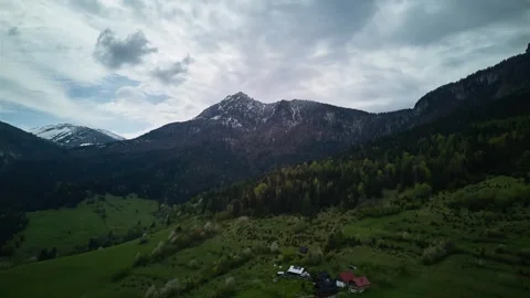 Aerial Hyperlapse spring Alps Mountains,fluffy clouds,green meadows and blooming Stock-Footage 275553750