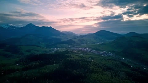 Aerial Hyperlapse spring Alps Mountains,fluffy clouds,green meadows and blooming Stock Footage 275596773