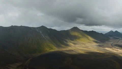 Aerial hyperlapse sun shining across mountains of Iceland Stock Footage 258041918