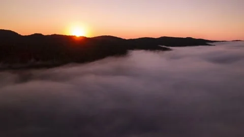 Aerial hyperlapse sunrise above clouds, fog bank, sea of clouds, beautiful Stock Footage 203387125