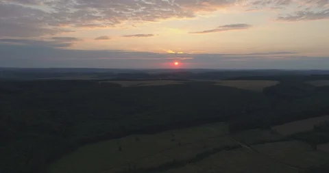 Aerial hyperlapse of sunset over forest Stock Footage 99020097