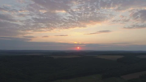 Aerial hyperlapse of sunset over forest Stock Footage 99020116
