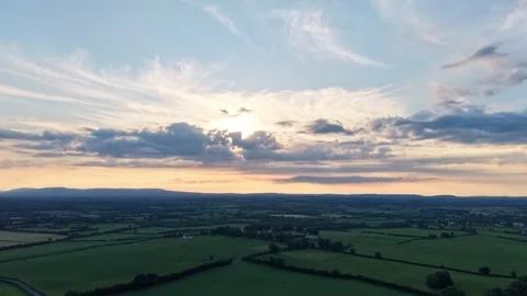 Aerial Hyperlapse of Sunset Over Rural Farmland and Horizon Stock Footage 337456573