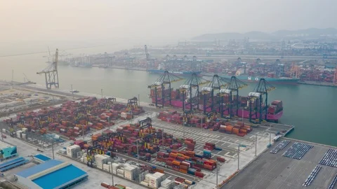 Aerial Hyperlapse Time lapse. Container ship in pier with crane bridge 스톡 동영상 123286344