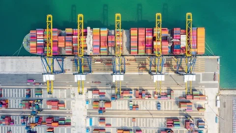 Aerial Hyperlapse Time lapse. Container ships in the harbor with bridges Crane  Stock Footage 125889090