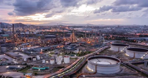 Aerial Hyperlapse Time-lapse of the refinery and oil tank at dusk. Business a Stock Footage 196597372
